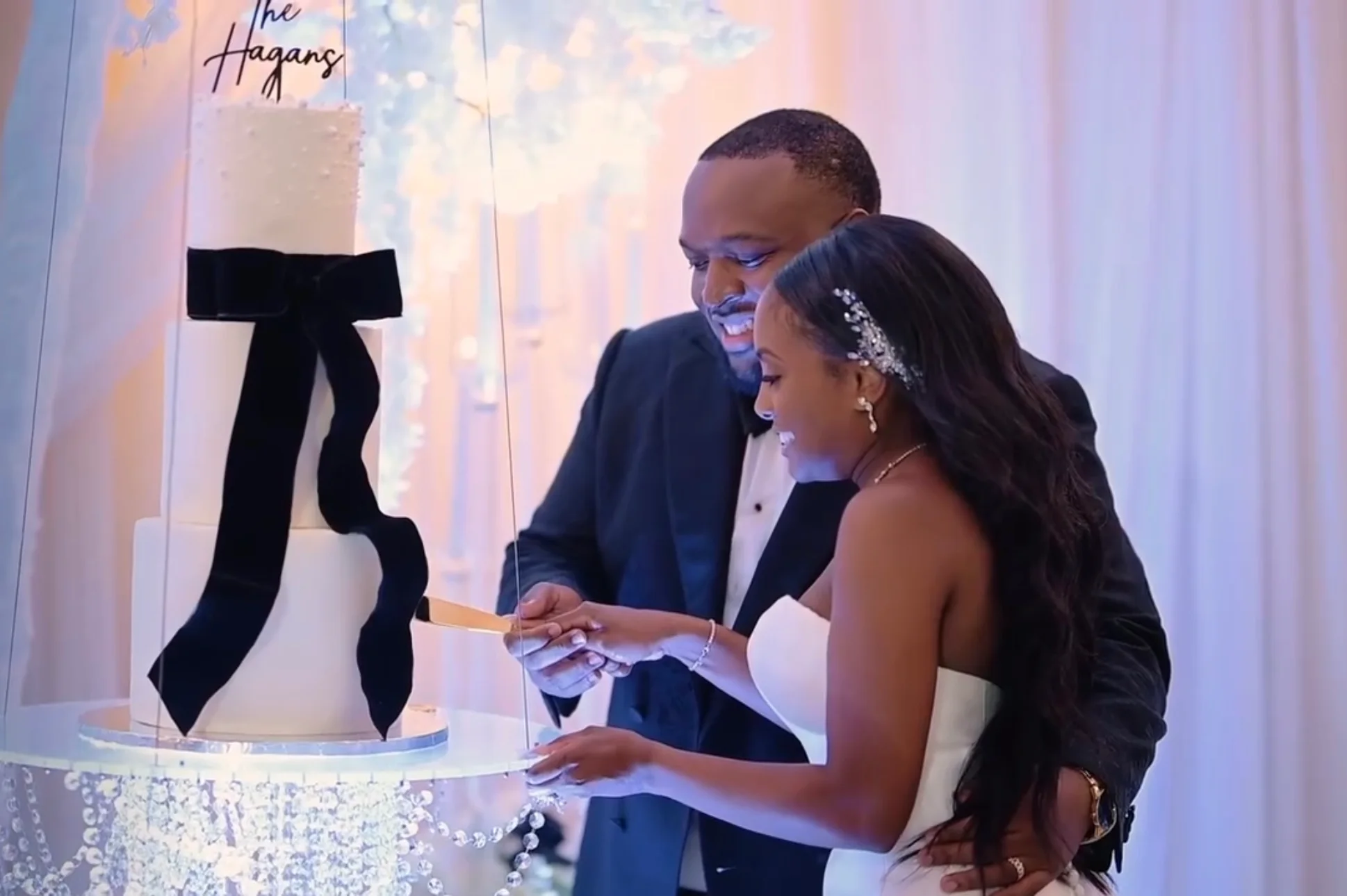 A wedding cake displayed for a reception.